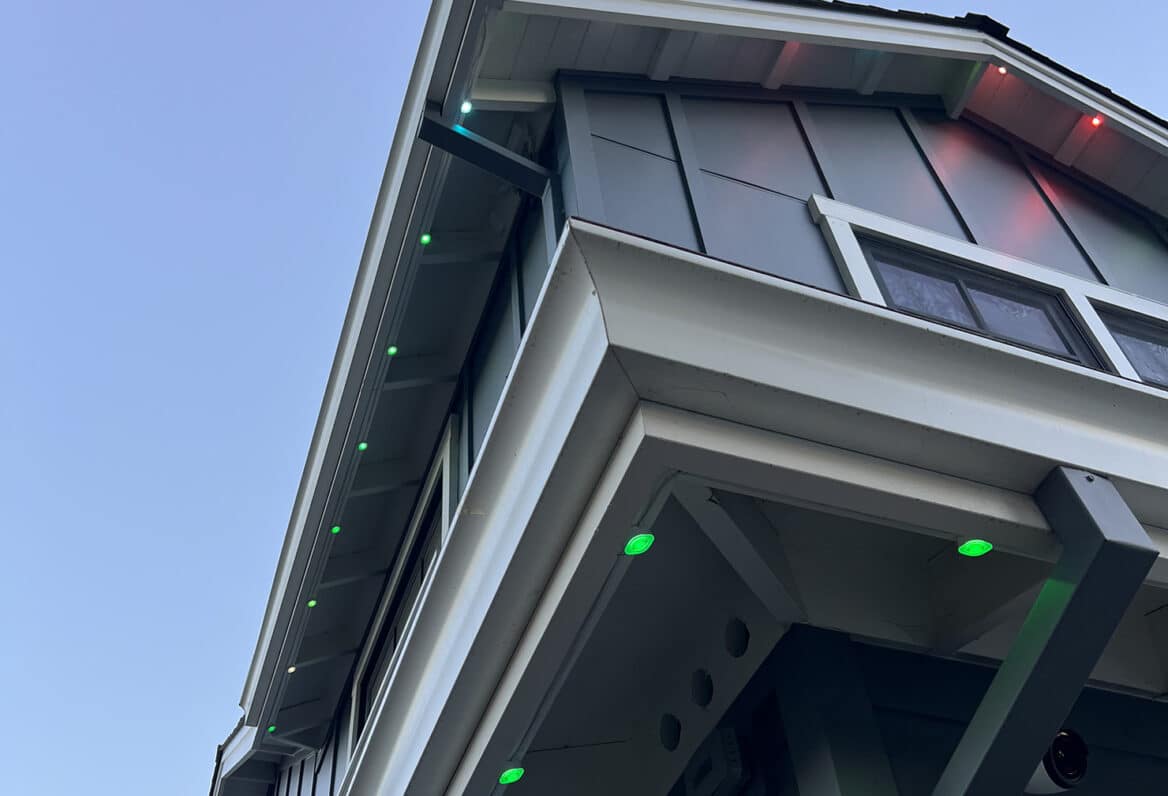 House with colored lights under eaves