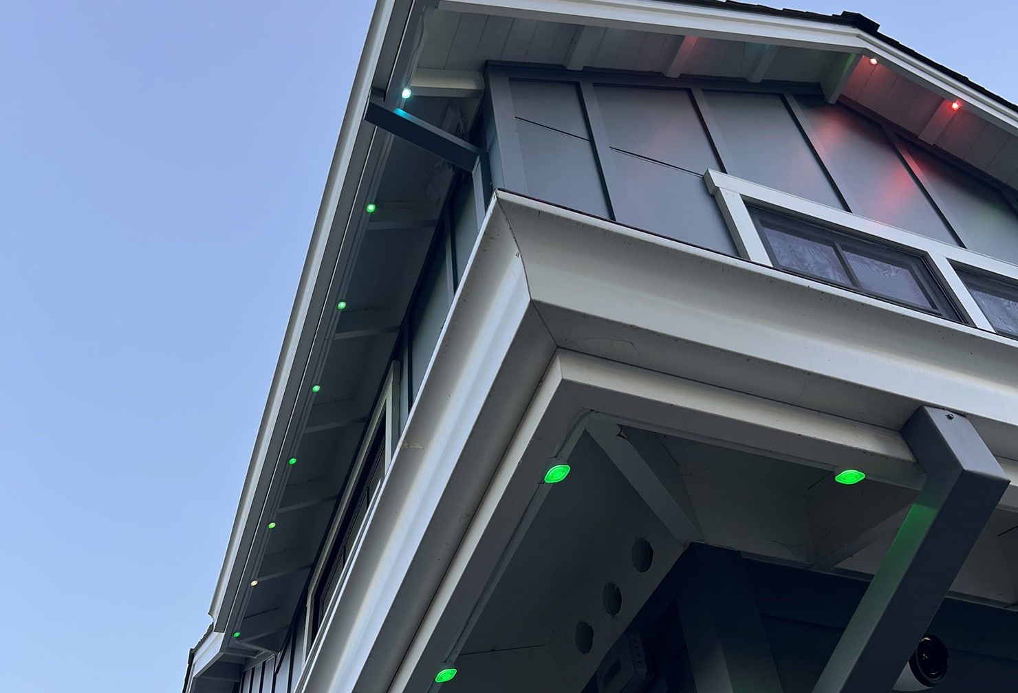 House with colored lights under eaves