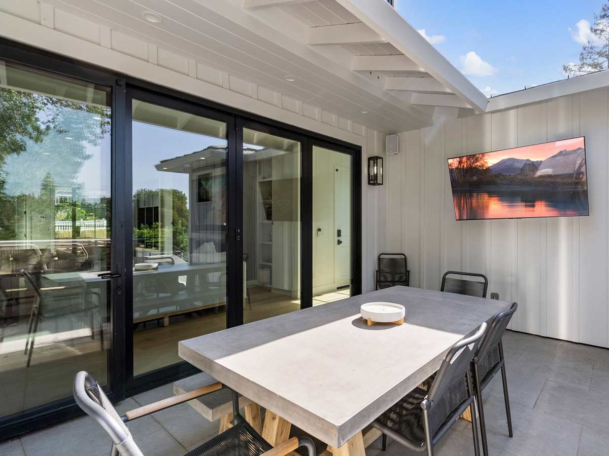 Patio with mounted television.