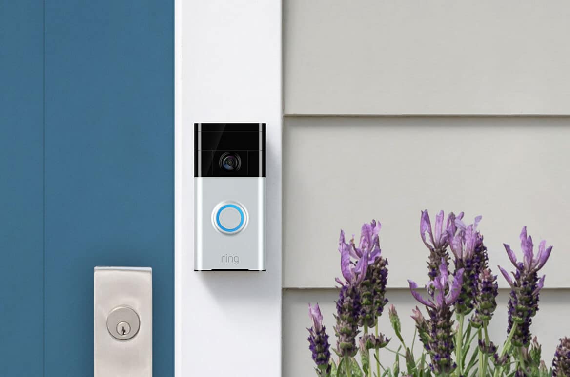 Ring camera doorbell shown on the front door of a house.