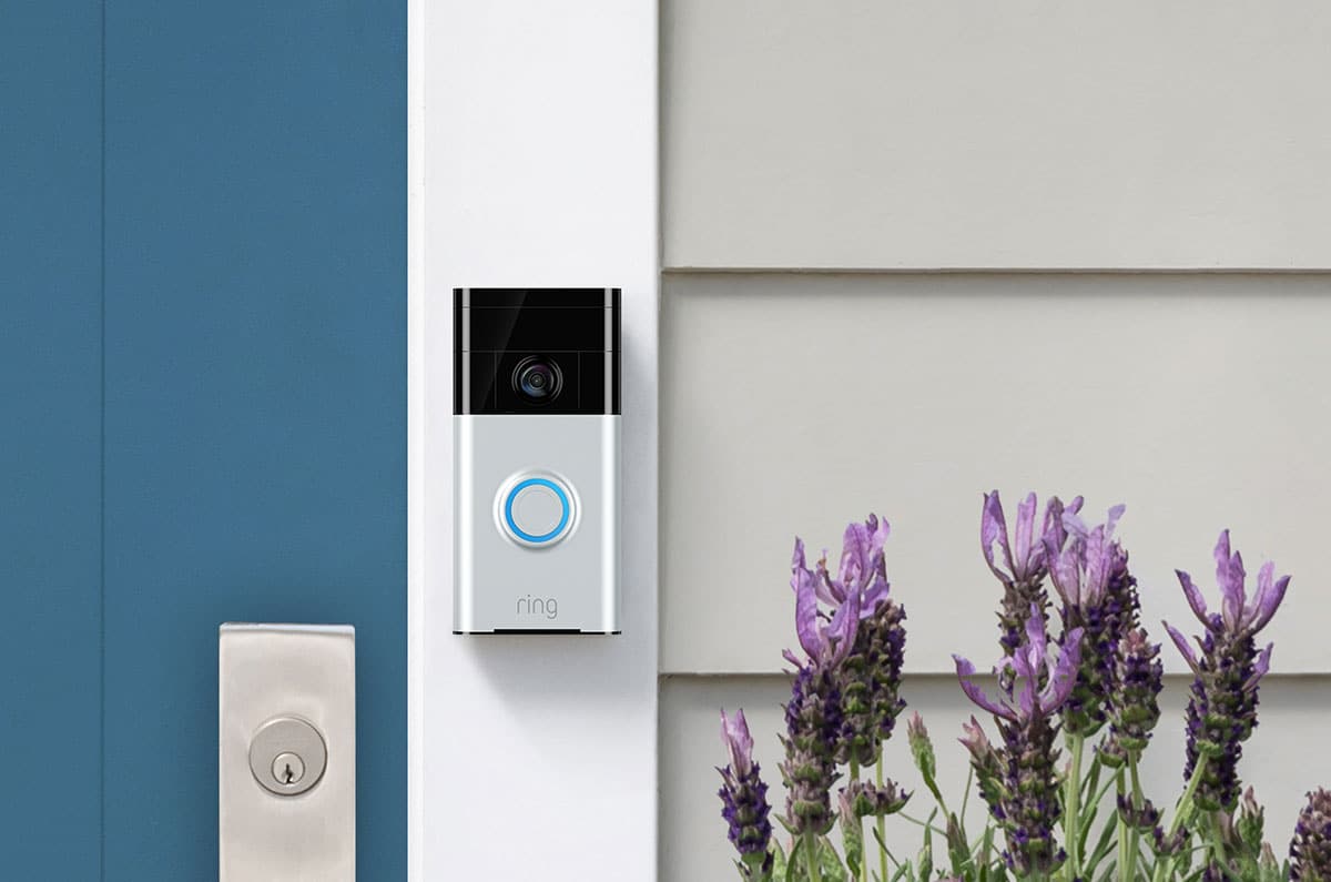 Ring camera doorbell shown on the front door of a house.