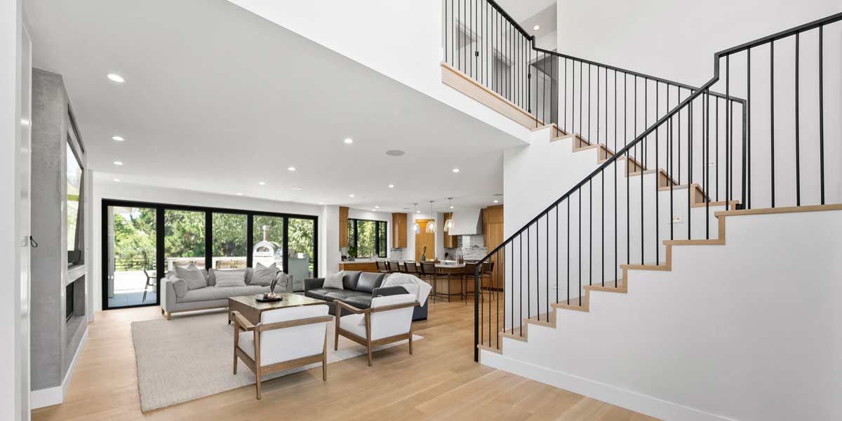 Modern open-plan living room with staircase